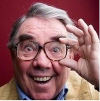 Image shows man wearing glasses smiling into the camera. The man is Ronnie Corbett 